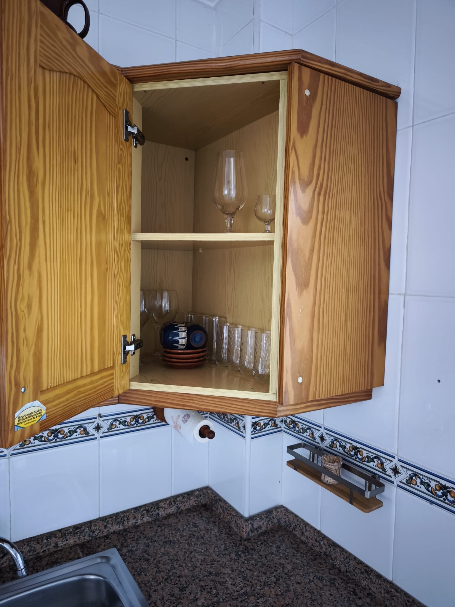 Kitchen cabinet with glasses and crockery