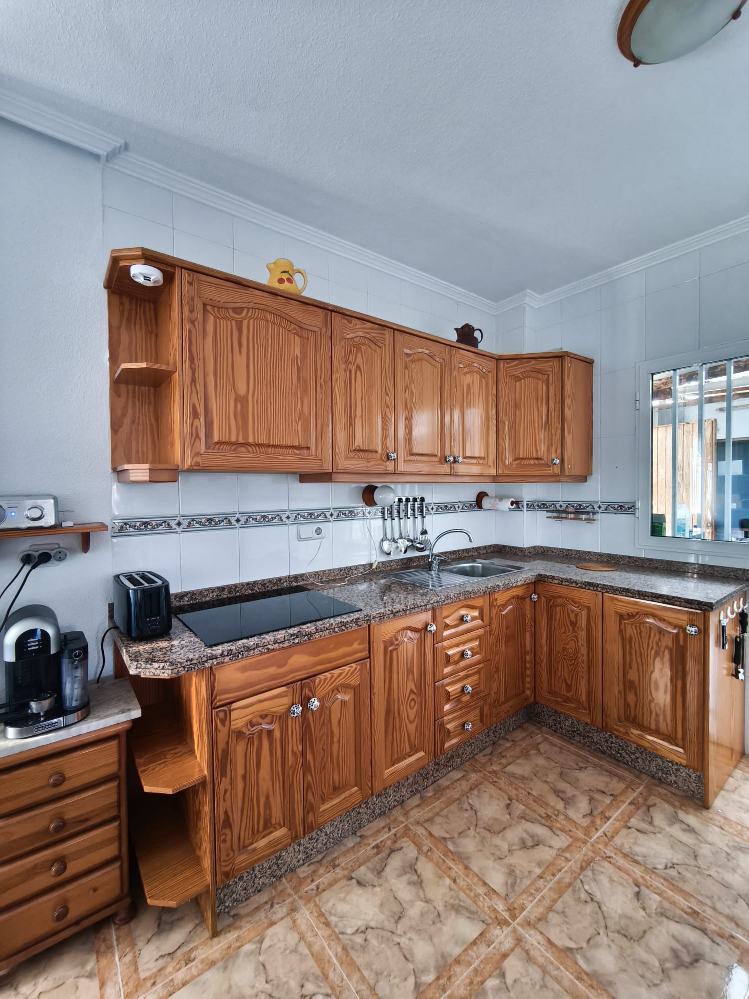 Full kitchen layout with coffee machine and toaster