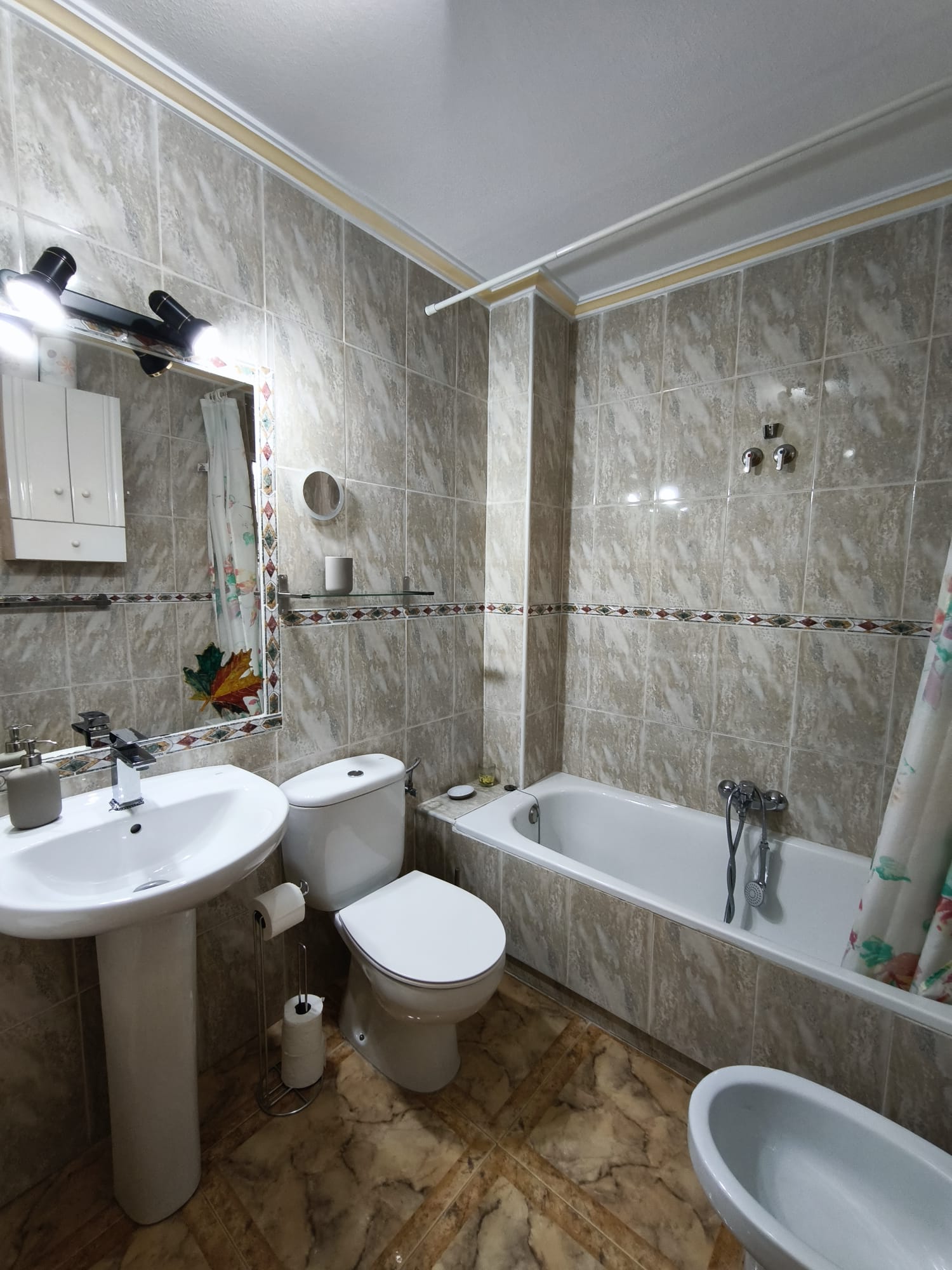 Bathroom with bathtub and bidet