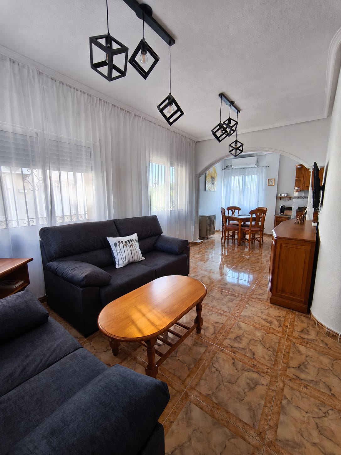 Open-plan living and dining area in Sunflower Apartment